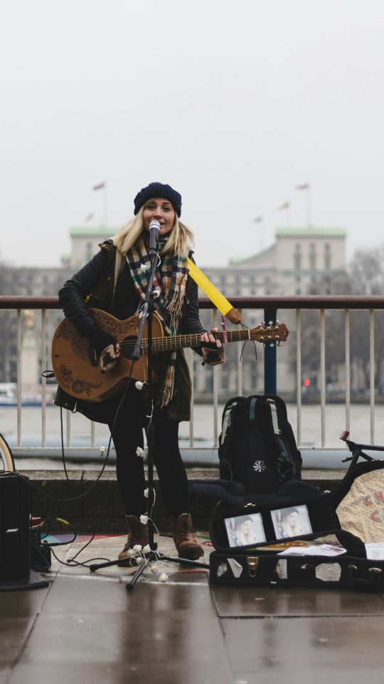 woman playing guitar
