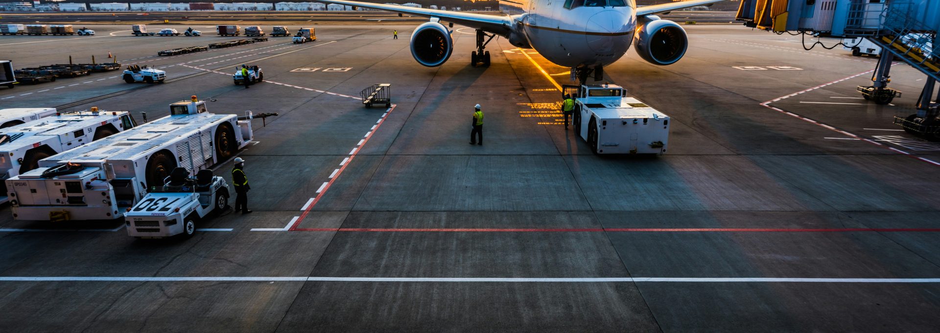 gray airplane on parking