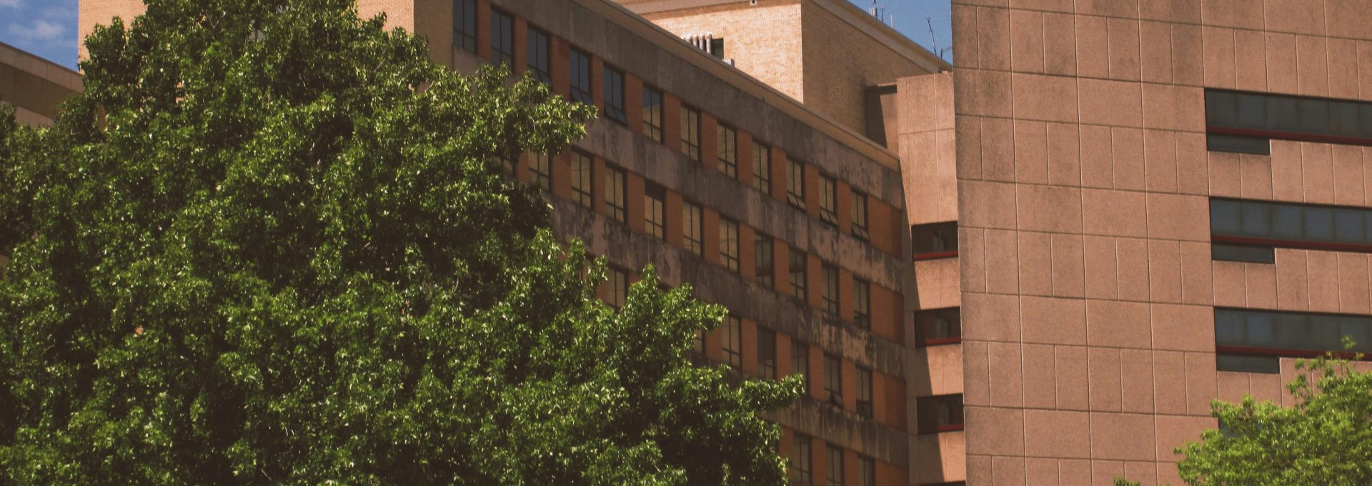 a tall building with a clock on the side of it