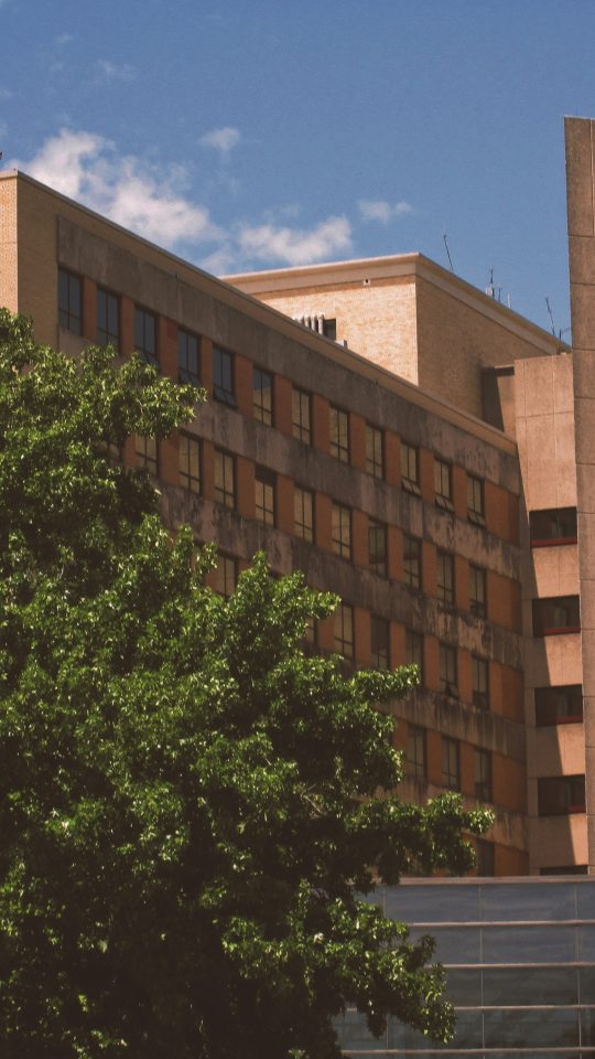 a tall building with a clock on the side of it